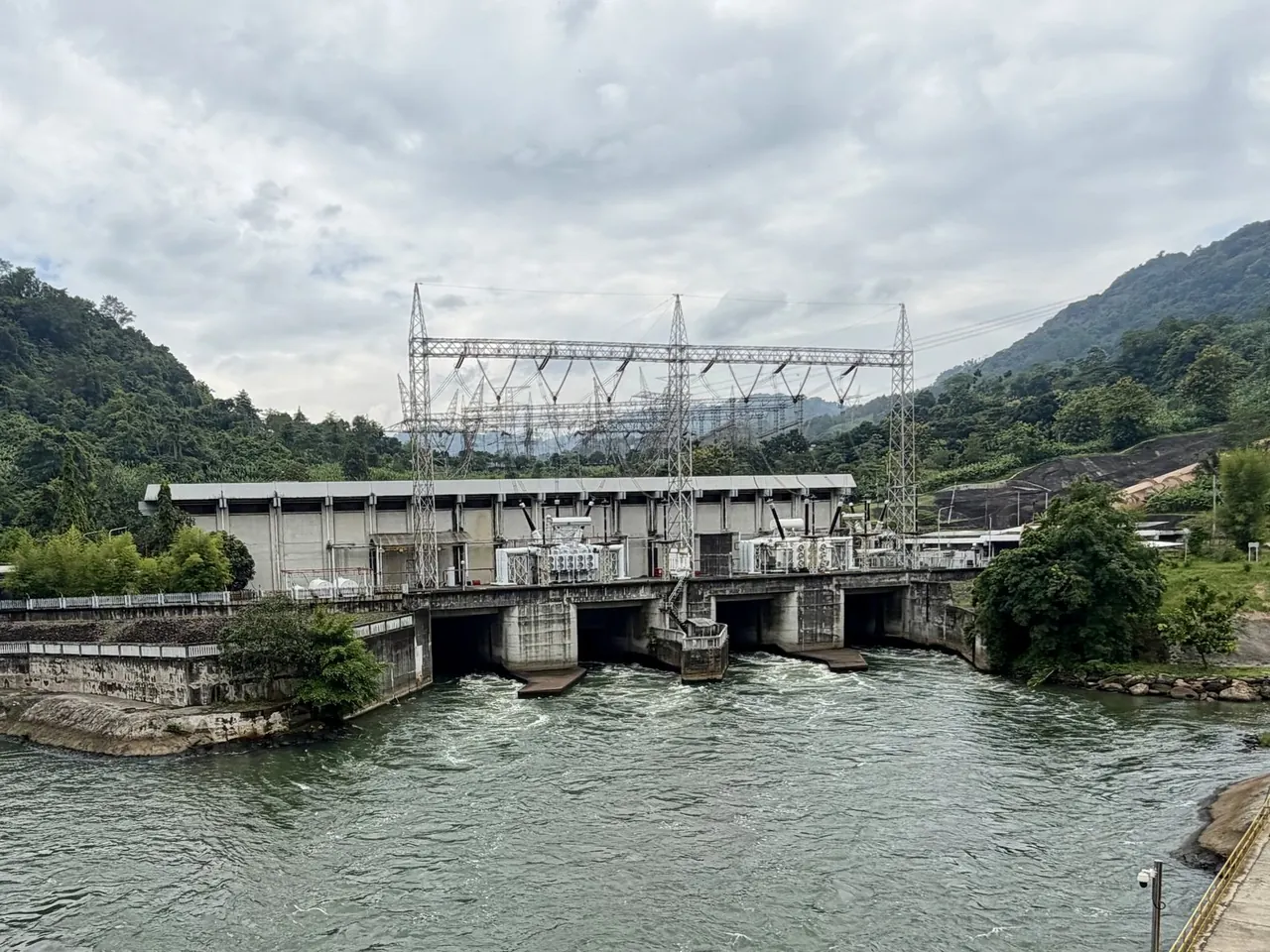 Hydropower station between forested hills